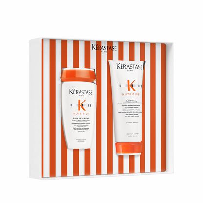 Kerastase Nutritive Set mit Shampoo und Conditioner in einer ausgefallenen Verpackung mit orange-weißen Streifen.