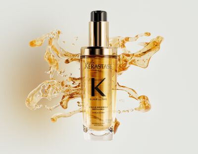 Das neue nachfullbare Elixir Ultime ist mit wunderschonen goldenen, strukturierten Haaroltropfen verziert.