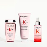 Kerastase Genesis Produktprasentation mit Shampoo, Conditioner, Serum, Kamm und Handen, die Beeren halten.