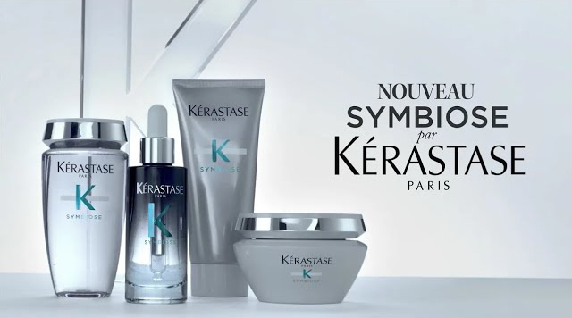 Produkte von Kérastase Paris, Teil der Symbiose-Serie, in edlem Design auf hellem Hintergrund.