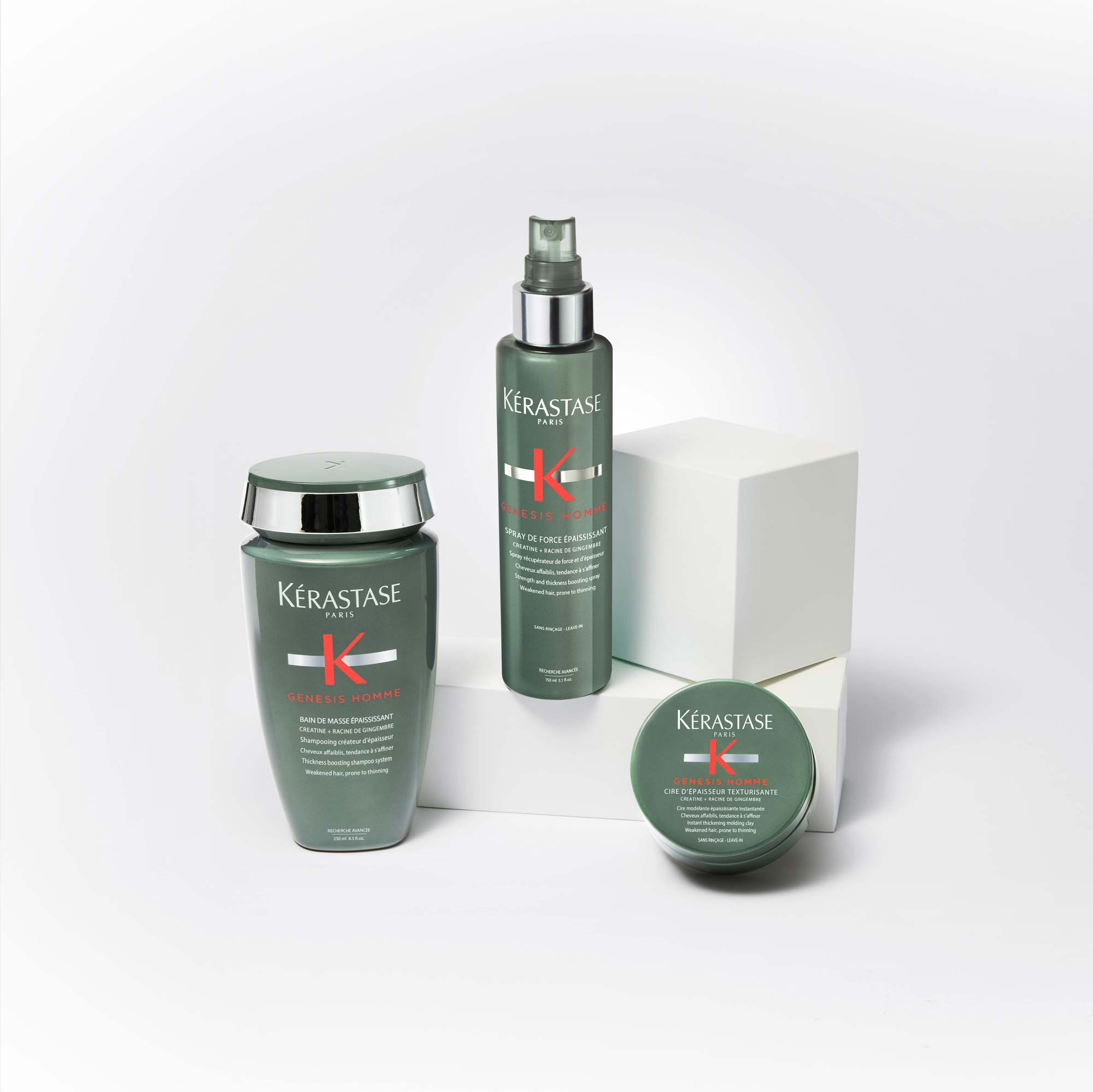 La rutina para combatir el cabello fino Drei Kérastase Produkte der Serie Genesis Homme auf einem weißen Hintergrund, darunter ein Shampoo und ein Refresh-Spray.